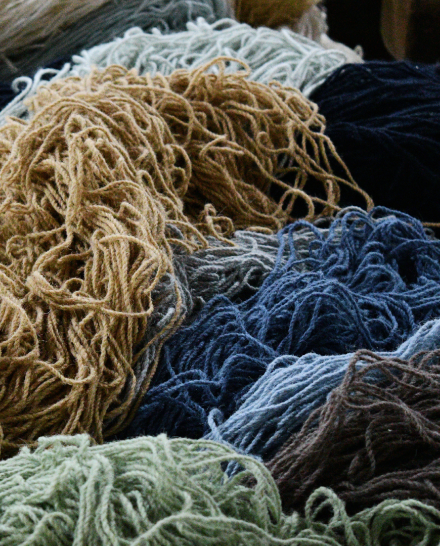 Yarns for weaving custom rugs in a variety of colors.