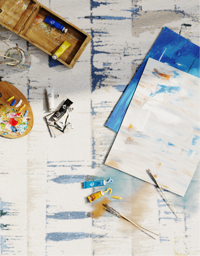 Paint and artwork on a designer rug