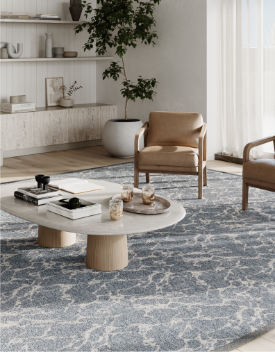 Living room scene with two armchairs, and a coffee table.