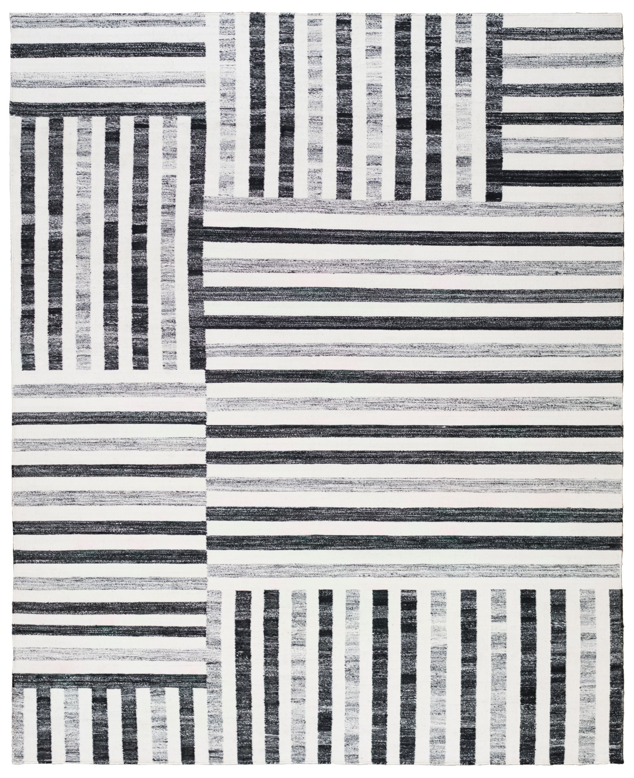 White and black full size rug with patterned lines.