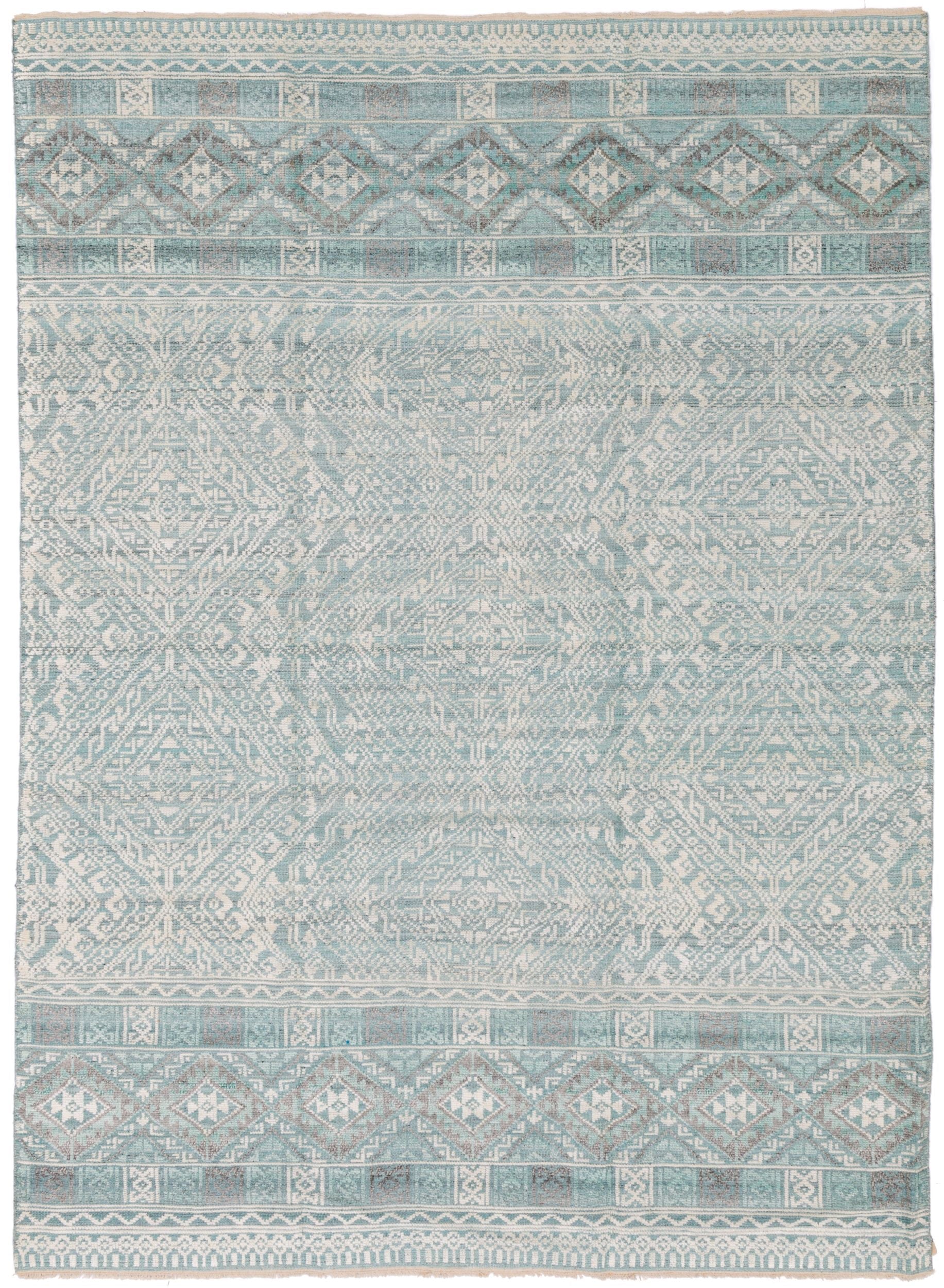 Full size Moroccan rug in cool blue colors.