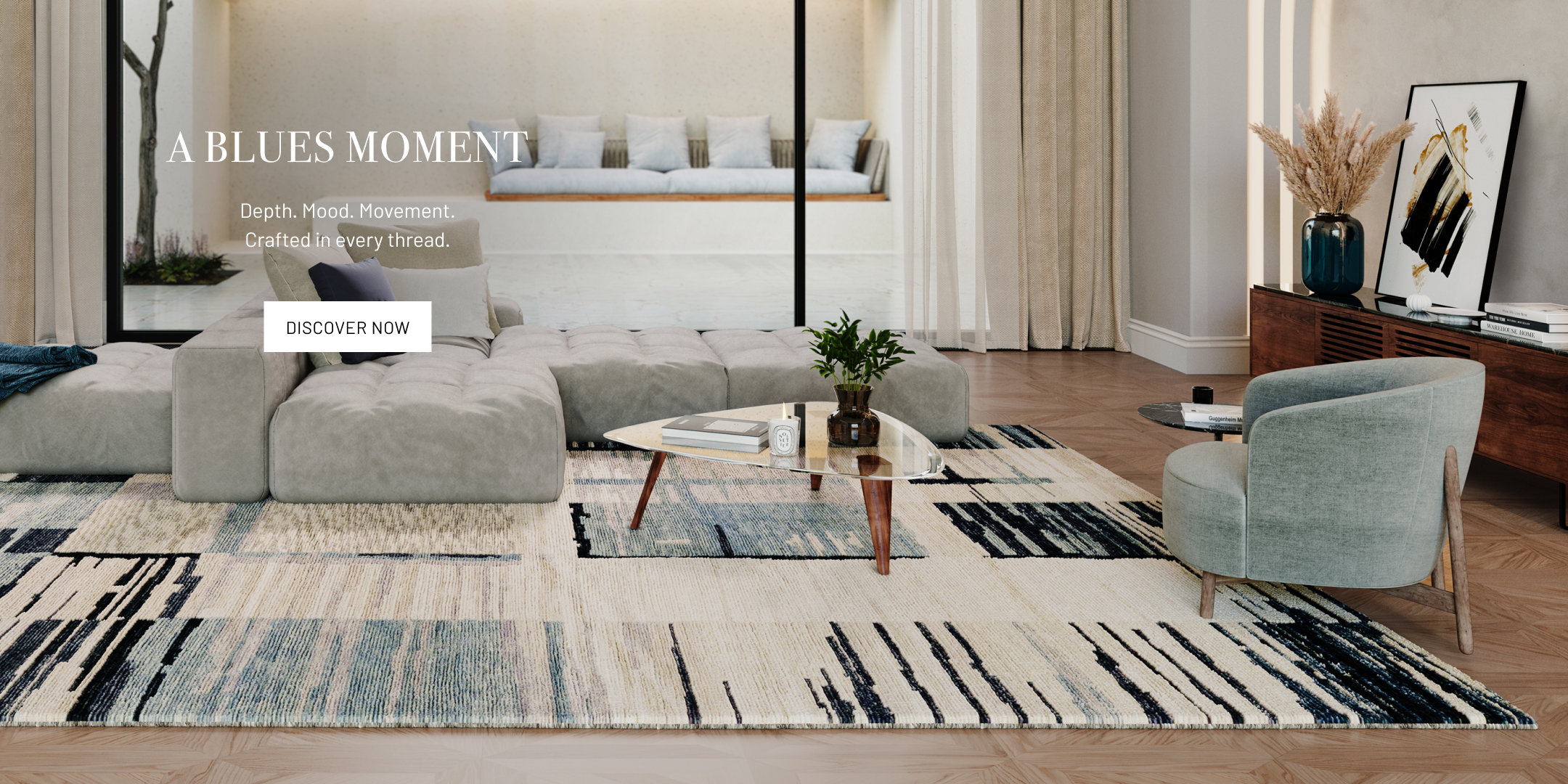 Modern living room with a gray sofa, coffee table, and decorative items.