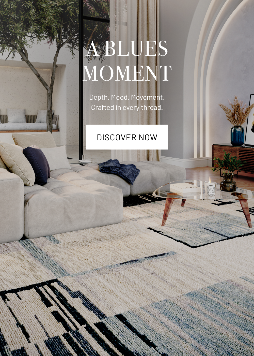 Living room with a patterned rug, sofa, and coffee table, featuring text about 'A Blues Moment'.