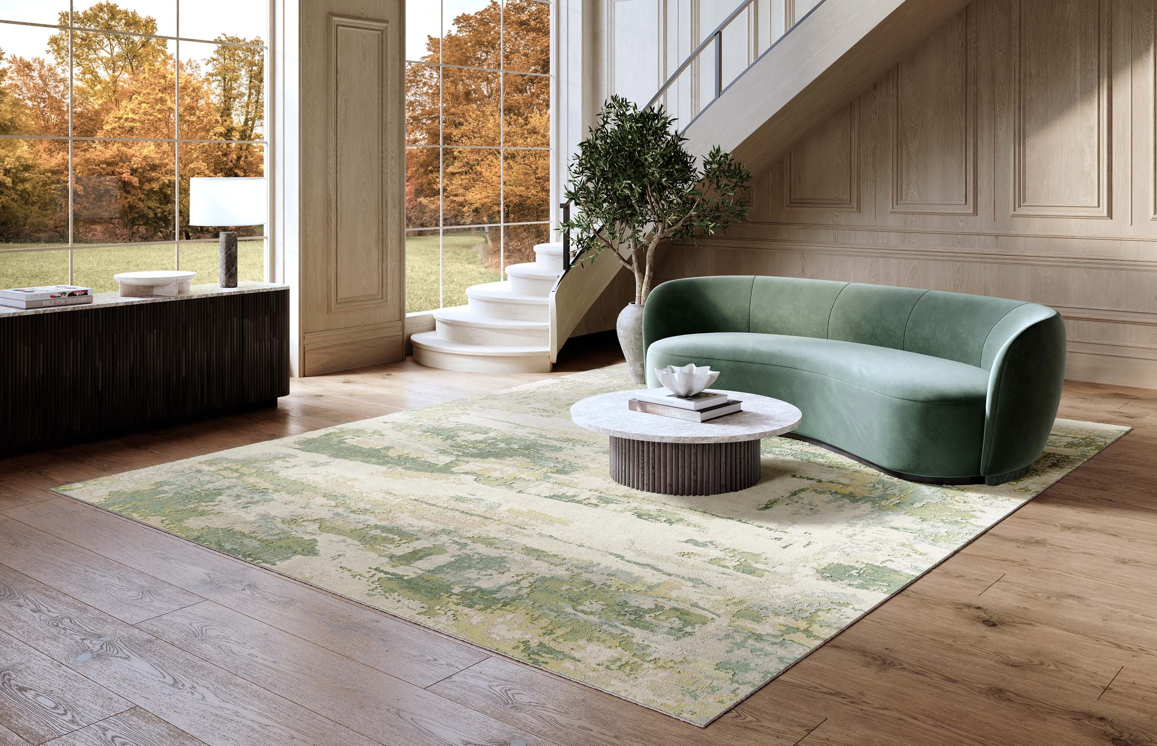 Modern living room with a green sofa, coffee table, and patterned rug.